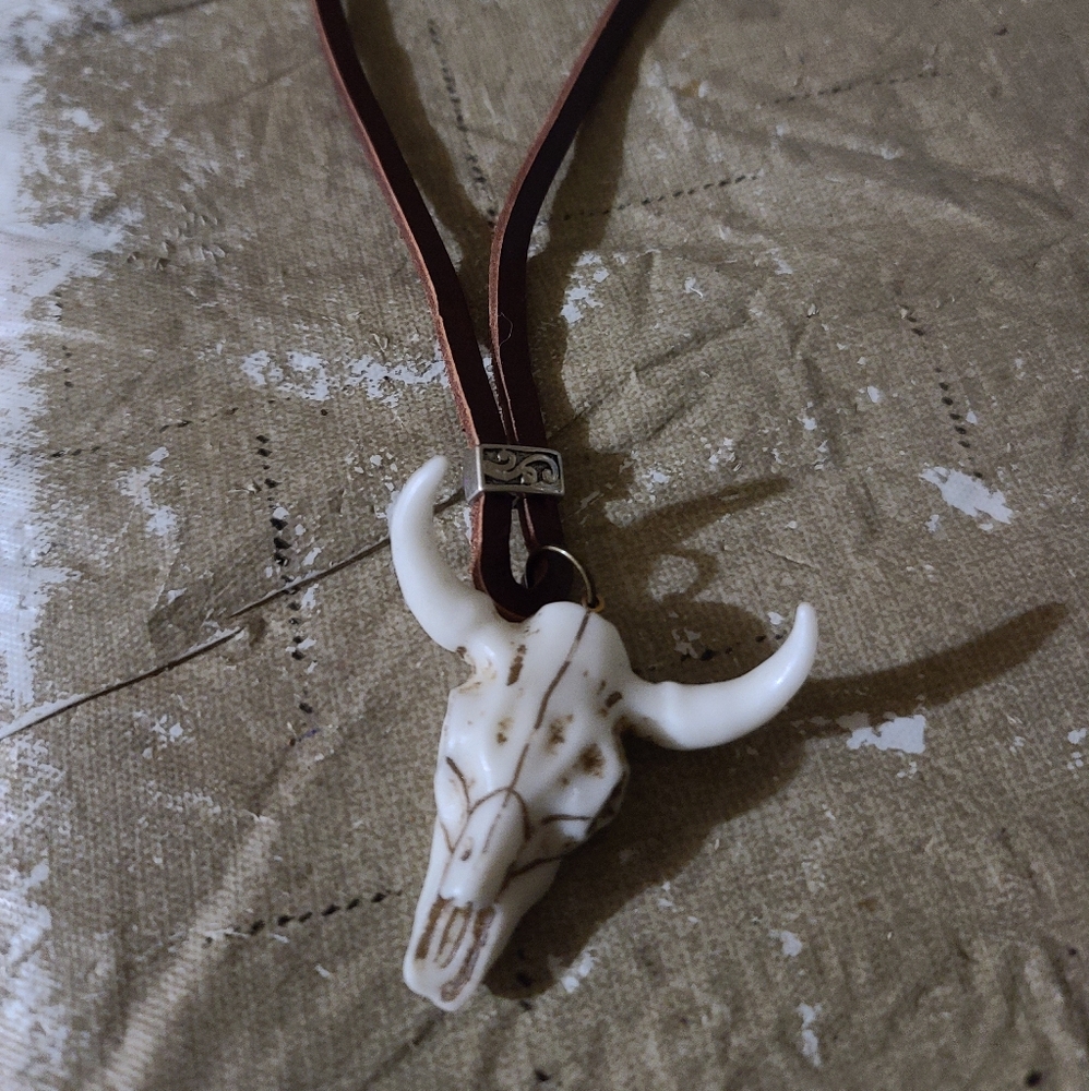 Cow skull and leather necklace